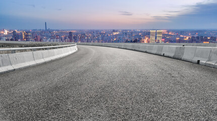 Empty road and city buildings background