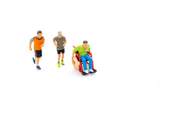 Miniature people Disabled happy friends having fun together  on white background