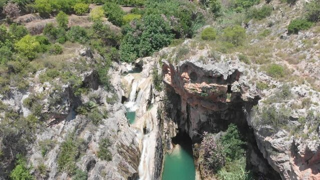 Summer fun in cool water of Canal de Navarres and waterfalls. Drone view.