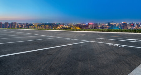 Empty road and city buildings background