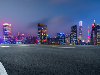 Empty road and city buildings background