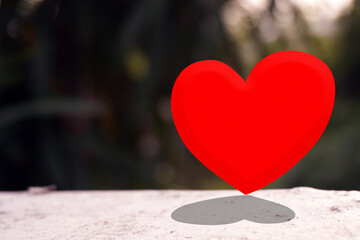Red heart on nature  background