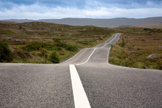 Road marking on long empty road