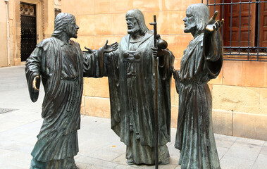 Alicante, Spain; 06/10/2019: statues of men talking standing in bronze