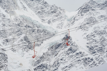 Cable car against the backdrop of the snow-capped Caucasus mountains, glacier seven