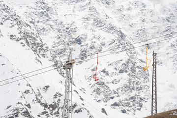 Cable car against the backdrop of the snow-capped Caucasus mountains, glacier seven