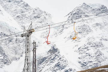 Cable car against the backdrop of the snow-capped Caucasus mountains, glacier seven