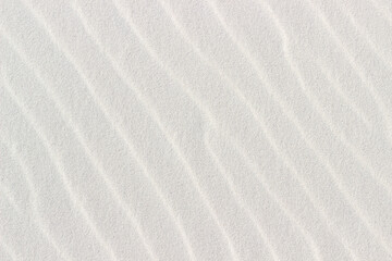 wavy white sand closeup used as background