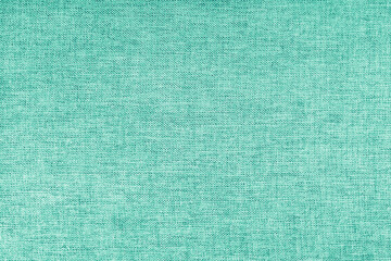 Texture of natural turquoise upholstery fabric or cloth. Fabric texture of natural cotton or linen textile material. Canvas background. Decorative fabric for curtain, furniture, walls, clothes