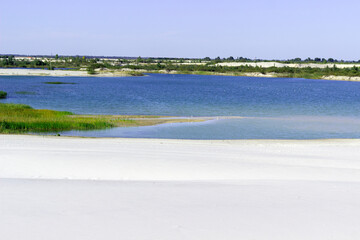 lake on the sandy shore on a sunny day, landscape