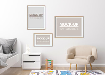 Empty picture frames on the wall in modern child room. Frames mock up in contemporary style. Copy space for your picture, poster. Bed, armchair, toys. Cozy room for kids. 3D rendering.