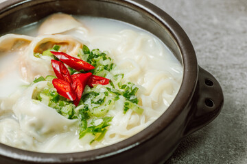 Korean style noodle soup with dumplings, mandu kalguksu