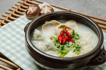 Korean style noodle soup with dumplings, mandu kalguksu