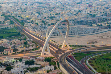 Aerial view of Al Wahda Bridge The Tallest Monument of Doha City. known as 56 Bridge of Arch