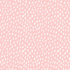 White polka dots hand drawn seamless patter on pink pastel background