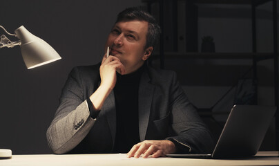  Inspiration muse. Pensive man. Late work. Creative thoughtful guy guessing ideas for writing...