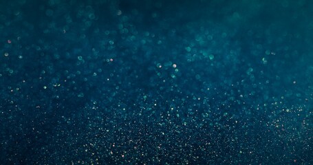 Bokeh light circles. Particles background. Blur glitter bubbles. Defocused blue orange color round sparkles texture dark abstract wallpaper.