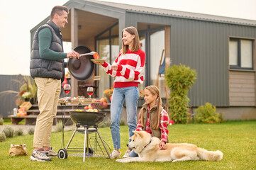 Family of three people enjoying their picnic