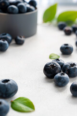 Blueberries fresh berry on bright background. Healthy food template, mockup with copy space.