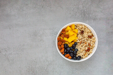 Bowl of oatmeal porridge with fresh fruits
