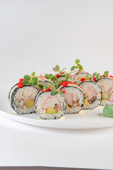 black and white sushi on plate