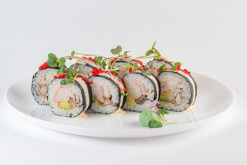 black and white sushi on plate