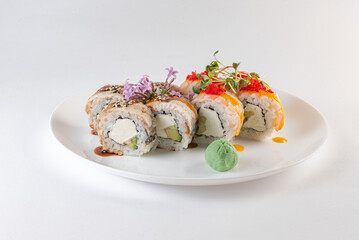 sushi on a plate with cheese and vasabi