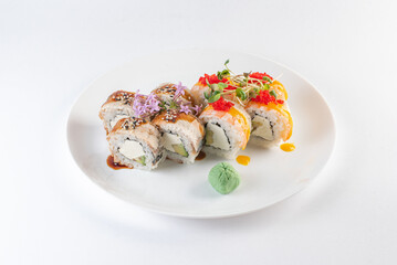sushi on a plate with cheese and vasabi