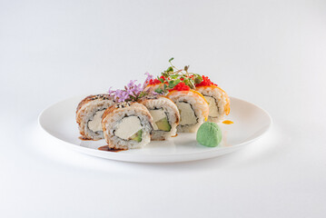 sushi on a plate with cheese and vasabi