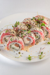 red sushi on a plate with souse