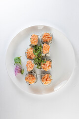 white sushi with salmon on a plate with vasabi