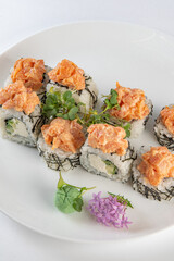 white sushi with salmon on a plate with vasabi