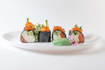 sushi rolls with avocado, salmon and vasabi
