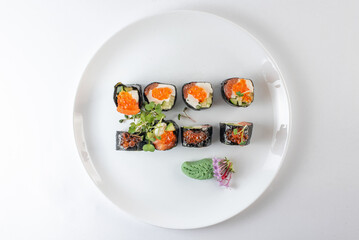 sushi rolls with avocado, salmon and vasabi