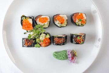 sushi rolls with avocado, salmon and vasabi