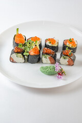 sushi rolls with avocado, salmon and vasabi