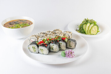 Lunch set. Sushi rolls, soup and salad