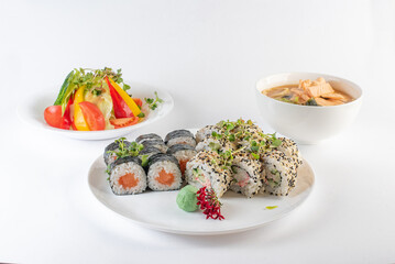 Lunch set. Sushi rolls, soup and salad