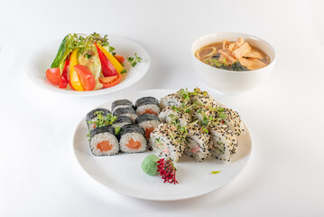 Lunch set. Sushi rolls, soup and salad