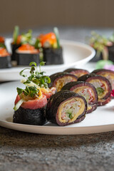 Fototapeta na wymiar sushi rolls on white plate