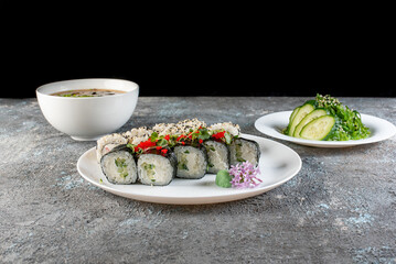 Lunch set. Sushi rolls, soup and salad