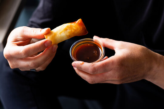 Eating chinese snacks.