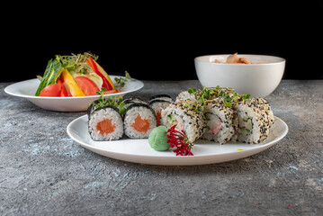 Lunch set. Sushi rolls and salad