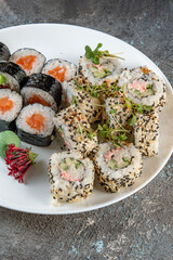 sushi on a plate with chopsticks