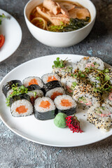 Lunch set. Sushi rolls, soup and salad