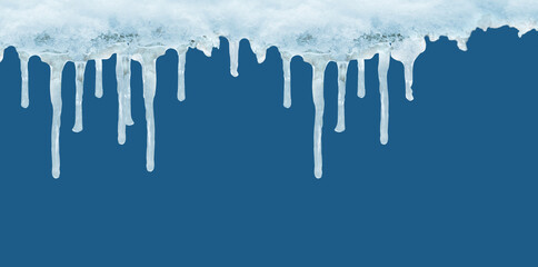 long ice icicles, spikes of ice formed when water falling from an object freezes, white snow against blue background, winter pattern, texture of ice, concept of freezing, cooling in housing