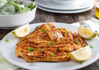Grilled chicken breast with a green salad with sour cream dressing
