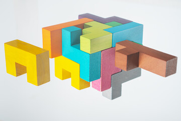 Obraz premium Abstract construction from wooden blocks. The concept of logical thinking..