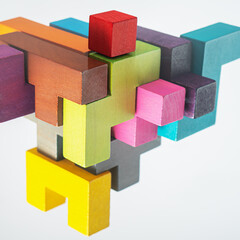 Obraz premium Abstract construction from wooden blocks. The concept of logical thinking..