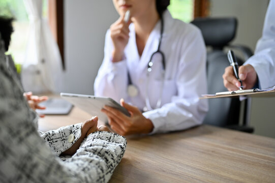 A female patient is having a medical checkup with her doctor. cropped image